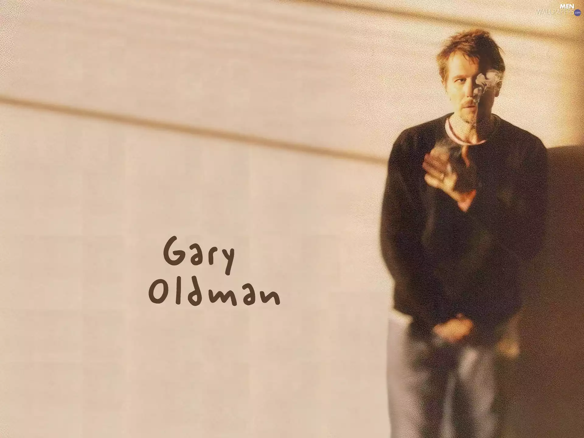Gary Oldman, black blouse