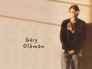 Gary Oldman, black blouse
