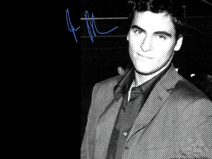 Joaquin Phoenix, gray dress