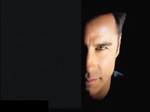 John Travolta, half face