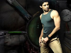 beige trousers, Hugh Jackman, gray shirt