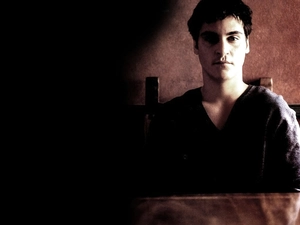 Joaquin Phoenix, black sweater